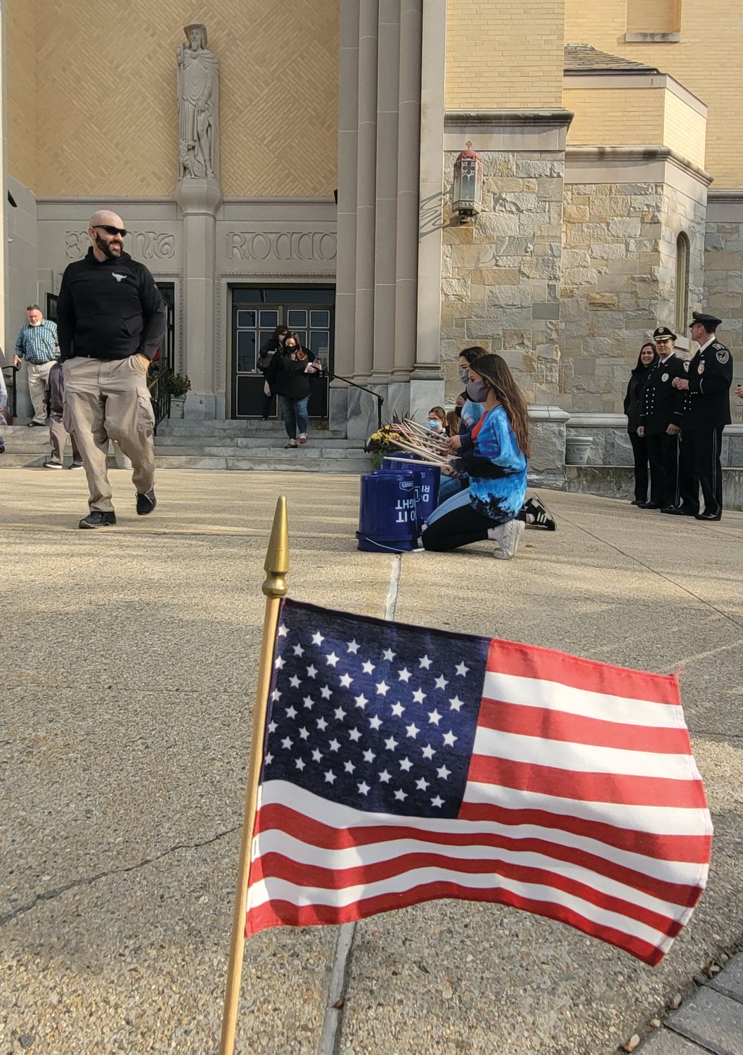 After the prayer service for veterans, outside, seventh grade St. Rocco students drummed to the song The Stars & Stripes Forever. 